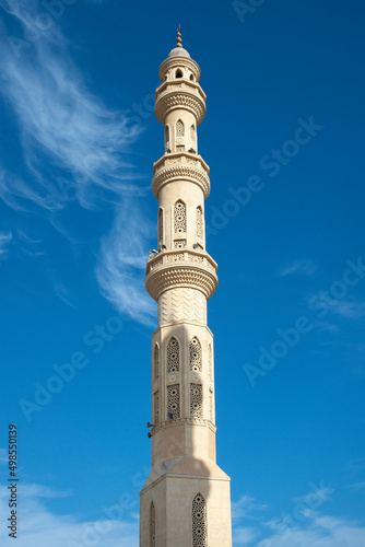 Minaret of El Mina Masjid Mosque Hurgada on blue sky background at Red sea coast, Egypt