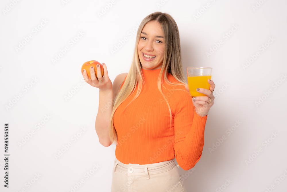 young woman with toothy smiling holding red apple. isolated studio portrait. young woman with toothy smiling holding red apple. isolated studio portrait.