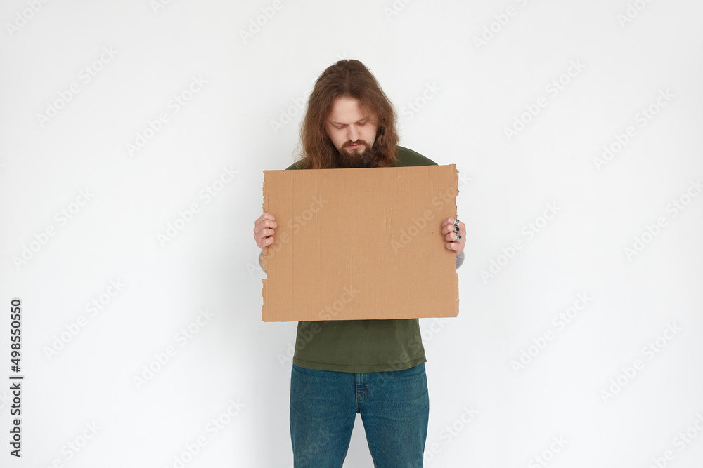 Ukrainian man refugee holding cardboard on white background Ukrainian man refugee holding cardboard on white background