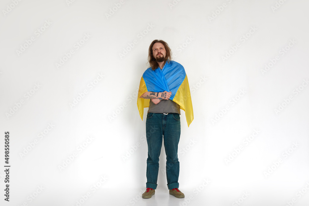 Ukrainian man refugee in flag on white background Ukrainian man refugee in flag on white background