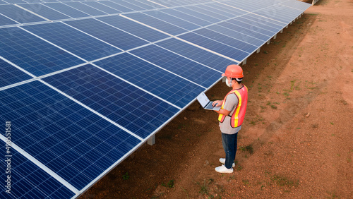 Technician checking the panel in solar power station panels,Renewable ecological source of energy from the sun