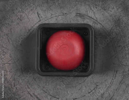 red alarm button on metal background