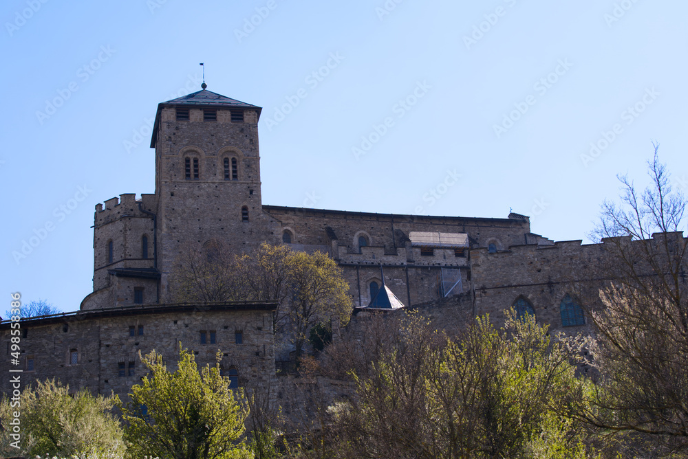 Beautiful medieval catholic church and castle Basilique de Valère (Valeria) on a hill at City of Sion on a sunny spring day. Photo taken April 4th, 2022, Sion, Switzerland.