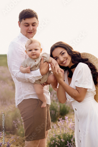 Beautiful young family in a lavender field spends the day © jul14ka