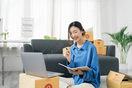 Starting small businesses SME owners female entrepreneurs Write the address on receipt box and check online orders to prepare to pack the boxes, sell to customers, sme business ideas online.