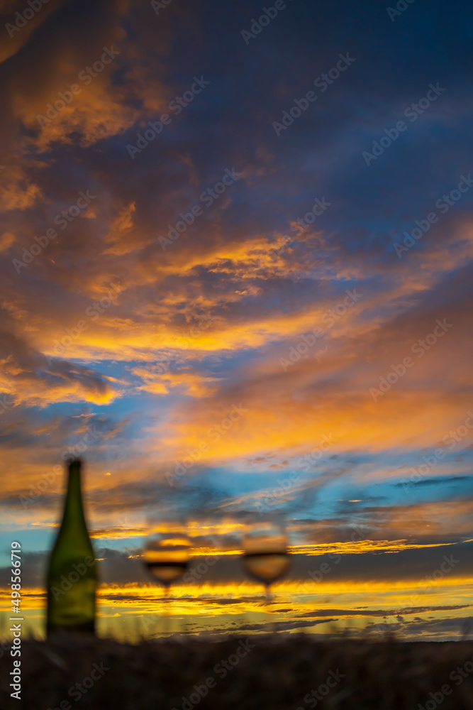 Fototapeta premium glass of wine with sunset in late summer