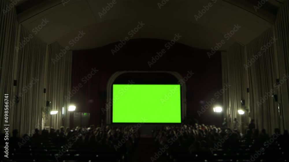 Cinema Hall with Green Screen and Blurred Audience. You can replace green screen with the footage or picture you want. You can do it with “Keying” effect in After Effects. 4K Resolution. Cinema Hall with Green Screen and Blurred Audience. You can replace green screen with the footage or picture you want. You can do it with “Keying” effect in After Effects. 4K Resolution.