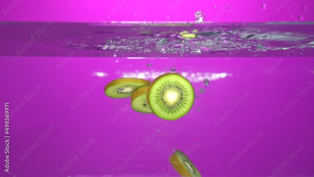 Slow motion kiwi slices in the water HD