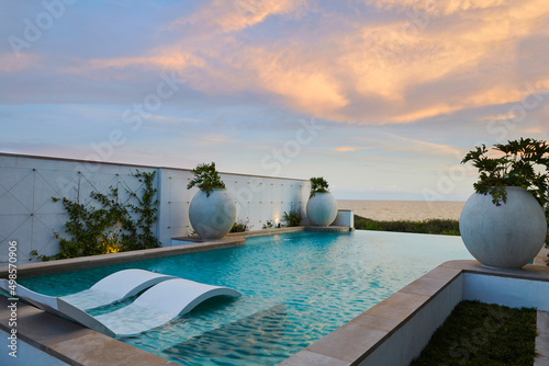 Gulf front pool at sunset photo