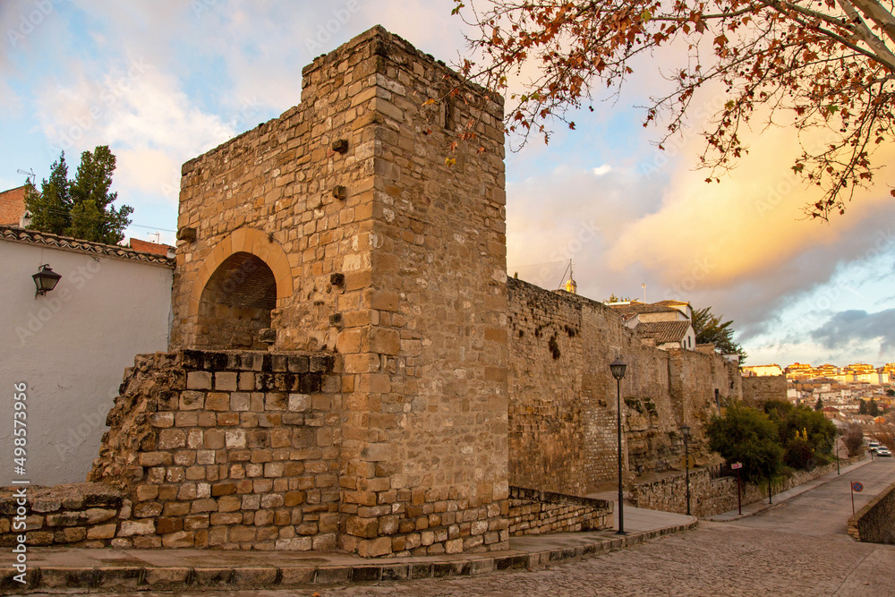 The ruins of an ancient fortress in a European city against the backdrop of a sunset beautiful sky. Úbeda, Spain. Beautiful landscape in the historic part of the city.