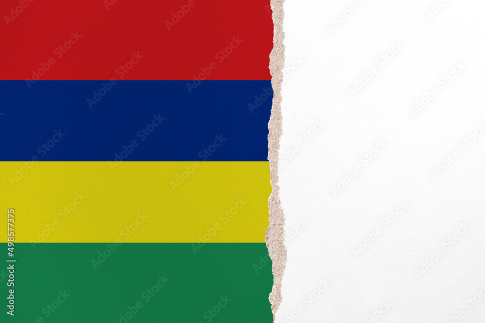 Half- ripped paper background in colors of national flag. Mauritius