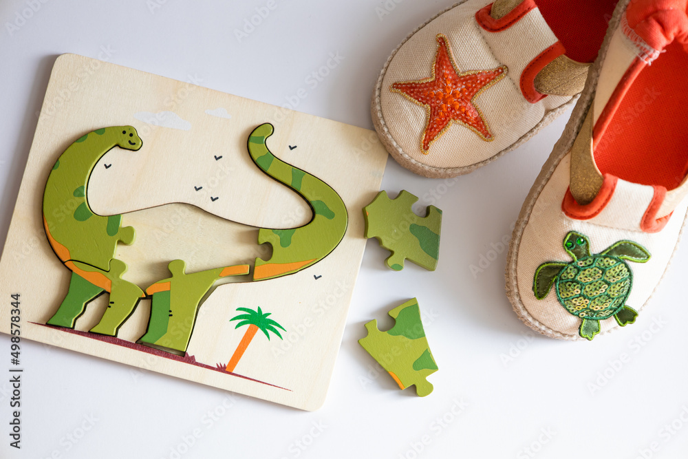 Children's toys. Logic game for kids. Happy child and fun Games. Children's house slippers and puzzle.