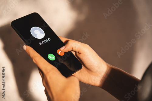 Fotobehang Woman Block a Phone Number or incoming Call from a anonymous sta