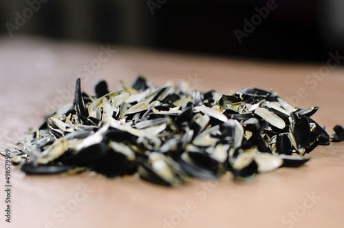 Pile of waste from seeds lies on the table. Close-up, selective focus.