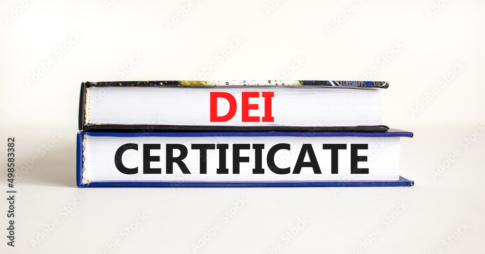 DEI diversity equity inclusion certificate symbol. Books with words DEI certificate on beautiful white background. Business DEI diversity equity inclusion certificate concept. Copy space.