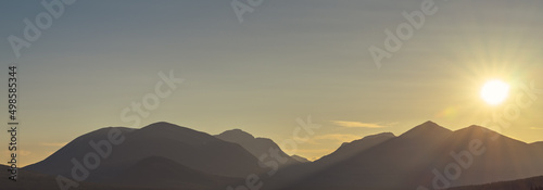 Sunset on the hills with blurred sky on the background in Norway photo