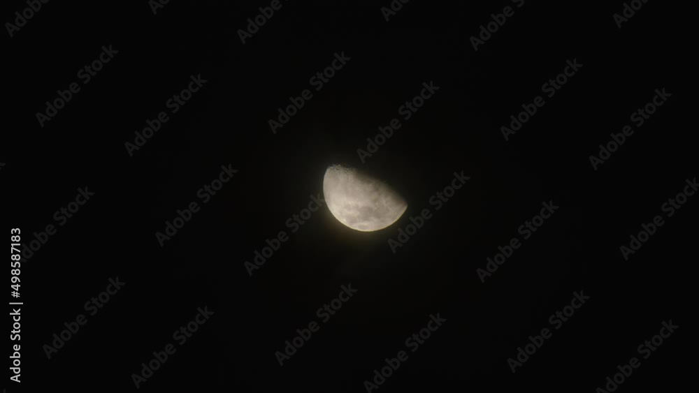 Cloudy night sky. Moon hiding as the clouds are appearing in the dark sky. Cloudy night sky. Moon hiding as the clouds are appearing in the dark sky.
