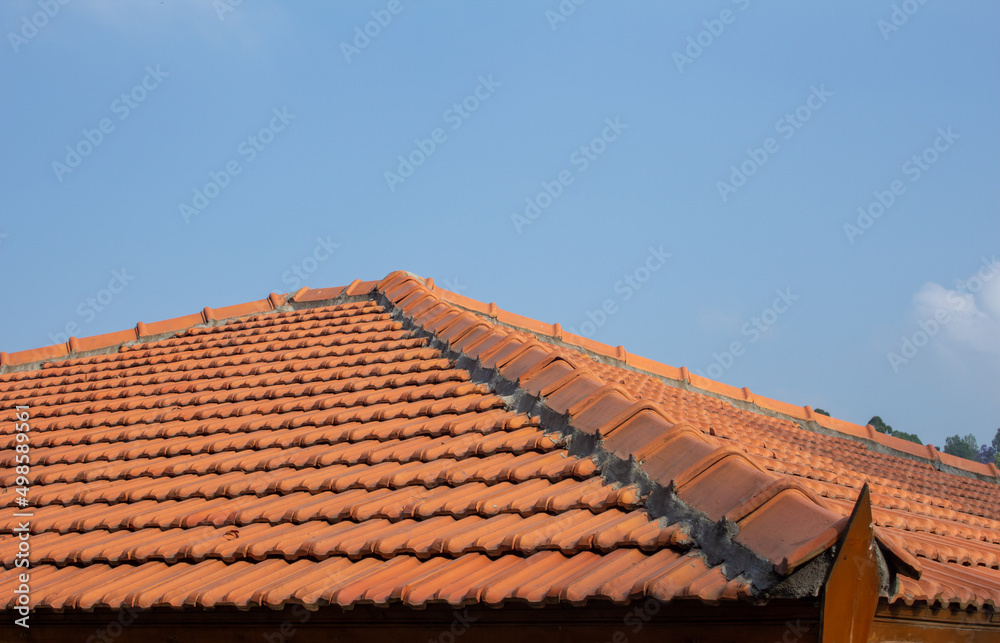 View of roof tiles on guest house. Retro styling of roof with tiles.