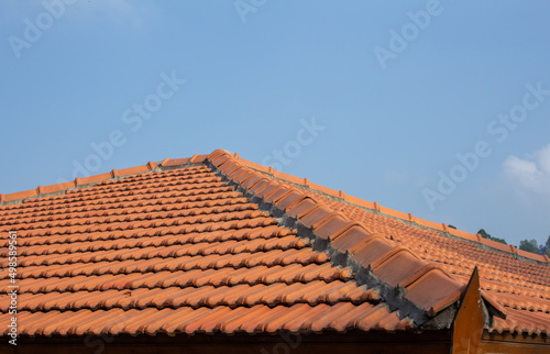 View of roof tiles on guest house. Retro styling of roof with tiles. © Manivannan T