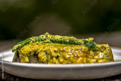 Selective focus shot of a Shorshe ilish -a fish dish from Kolkata West Bengal photo
