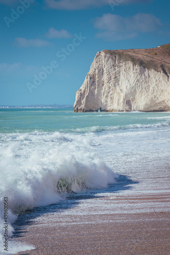 Фотография Waves on the sunny sand beach, Jurassic Coast, Dorset, UK