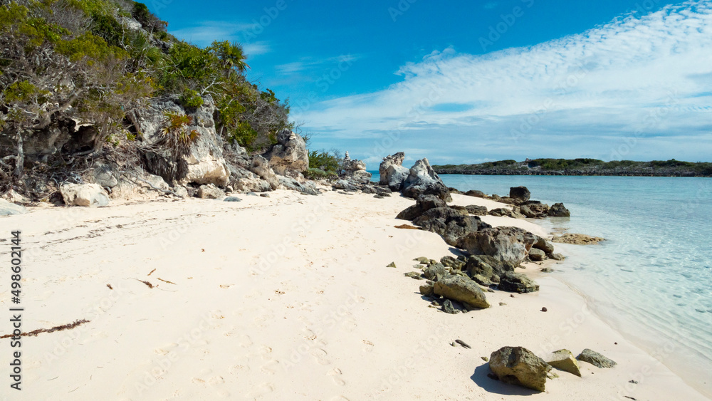 paradise carribean blue ocean island stacked rocks sky bahamas sea shore beach sand travel trees hill