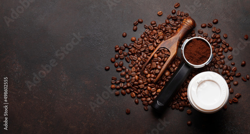 Roasted coffee beans and ground coffee in filter holder