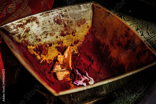 Photography Photo of red henna in a metal bowl