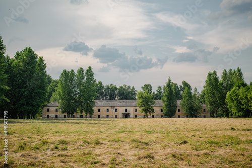 Picturesque urban vintage landscape before a thunderstorm. The ruins of the soldiers' barracks of the old fortress.