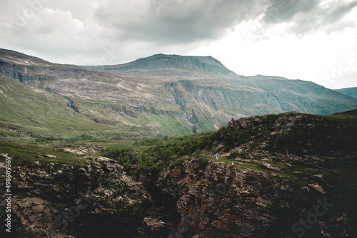 Canvas-taulu Beautiful landacape view of large green rocky hills against light cloudy sky
