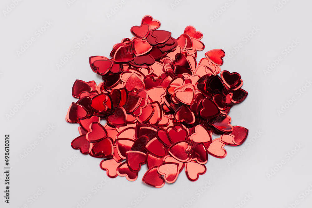 heart shaped confetti isolated on gray surface heart shaped confetti isolated on gray surface