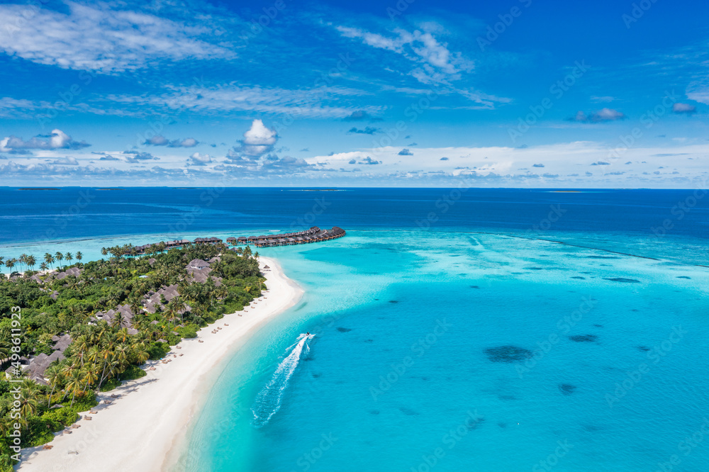 Maldives paradise scenery. Tropical aerial landscape, seascape with long jetty, water villas with amazing sea and lagoon beach, tropical nature. Exotic tourism destination banner, summer vacation
