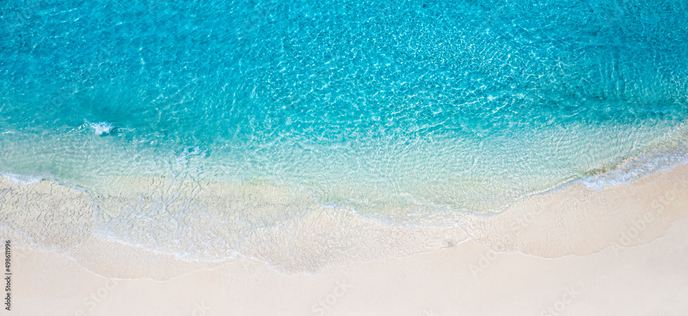 Obraz premium Relaxing aerial beach scene, summer vacation holiday template banner. Waves surf with amazing blue ocean lagoon, sea shore, coastline. Perfect aerial drone top view. Bright beach panorama, seaside