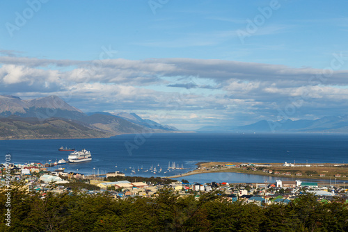 Aerial view of Ushuaia city port with boats and cargo ships. End of the world