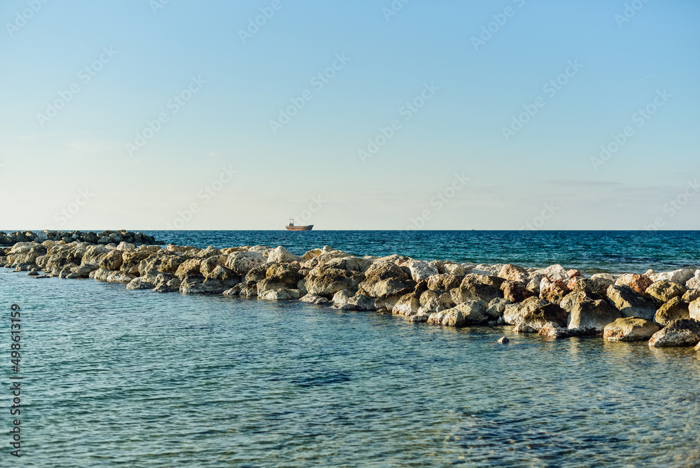Rocky coastal landscape scene at shore of ocean. High quality photo
