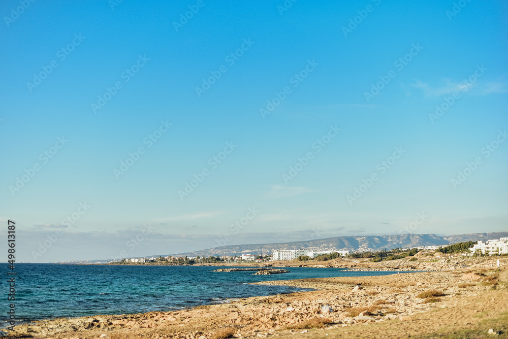 white houses on the mediterranean sea island of cyprus, houses on the rocks, blue sky, sea shore white houses on the mediterranean sea island of cyprus, houses on the rocks, blue sky, sea shore