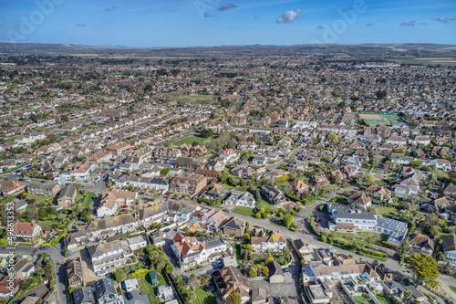 Aerial view of East Preston Village and Angmering on Sea with the South Downs in the background.