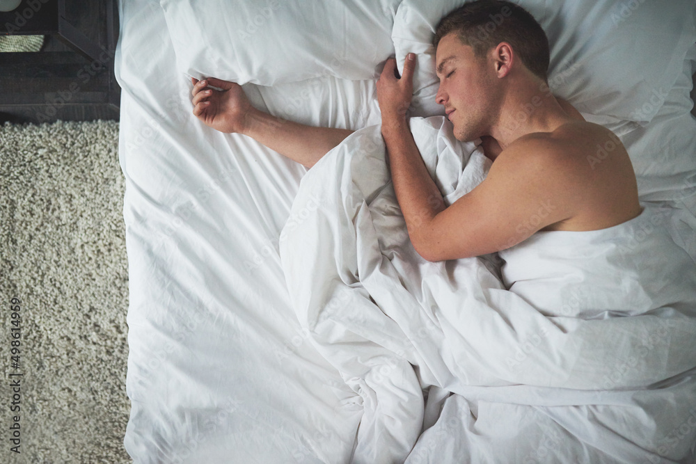 The pleasure of sleep. Cropped shot of a shirtless young man sleeping