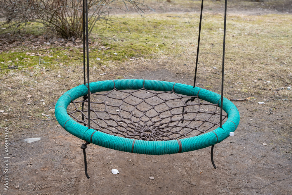 Detail of empty swing on playground. Latvia. Detail of empty swing on playground. Latvia.