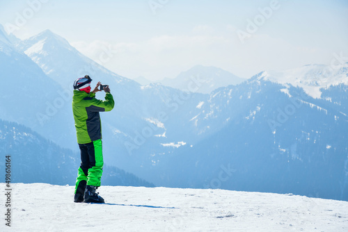 Obraz na plátně Skier taking photos from the top at Madonna di Campiglio Ski Resort, located at the area of the Brenta Dolomites in Italy, Europe
