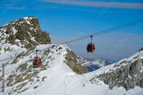 Gondola lift at Ponte di Legno ski resort at Mount Adamello in Italy, Europe. Beautiful destination in the Italian Alps with picturesque landscape.