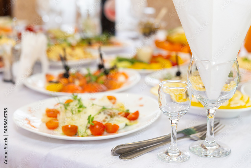 Table set for wedding or another catered event dinner. Table set for wedding or another catered event dinner.