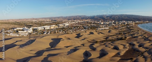 Fotografering Aerial drone landscape of Maspalomas golden sand dunes at sunrise, Gran Canaria,