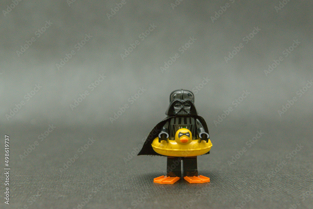 Naklejka premium Minifigure of Darth Vader on vacation wearing a duck float and fins