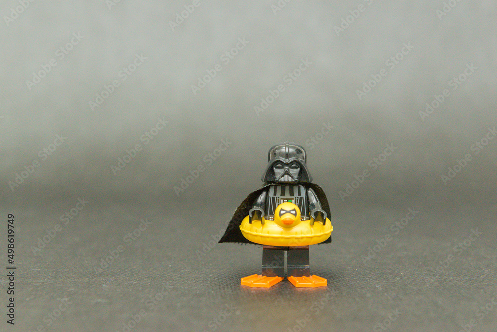 Fototapeta premium Minifigure of Darth Vader on vacation wearing a duck float and fins