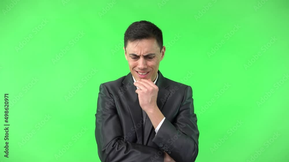 Focused worried man touching chin and thinking Focused worried man touching chin and thinking