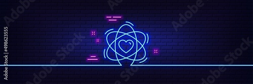 Neon light glow effect. Atom with heart line icon. Energy sign. Chemical element symbol. 3d line neon glow icon. Brick wall banner. Atom outline. Vector