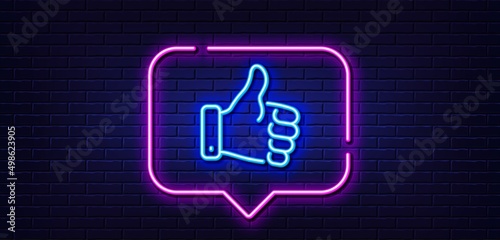 Neon light speech bubble. Like hand line icon. Thumbs up finger sign. Gesture symbol. Neon light background. Like hand glow line. Brick wall banner. Vector