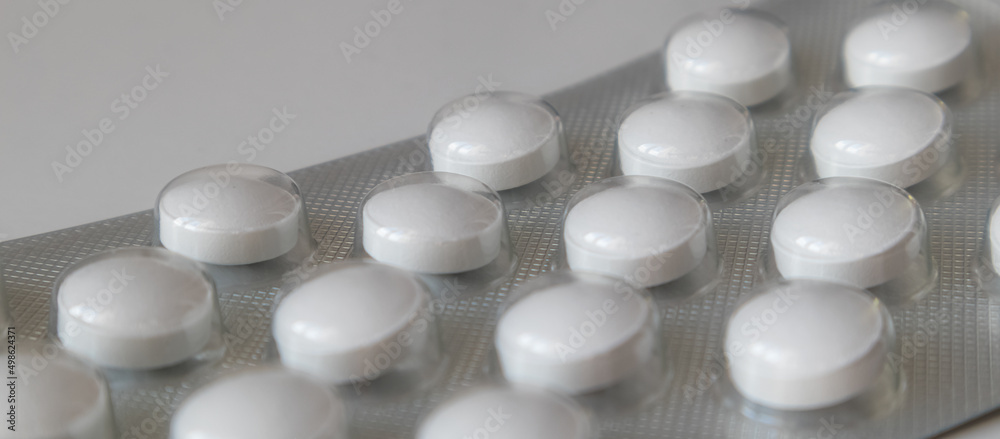 Tablets in a package close-up , light background. Banner. Tablets in a package close-up , light background. Banner.
