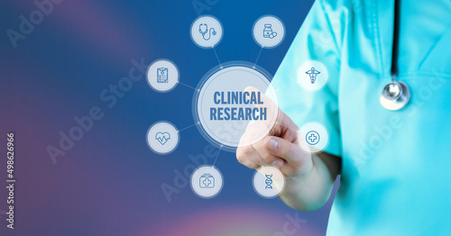 Clinical research. Doctor points to digital medical interface. Text surrounded by icons, arranged in a circle.